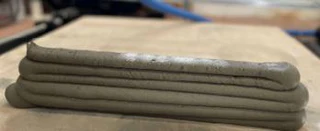 Close-up of a freshly extruded concrete bead.