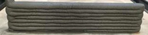 Stacked printed concrete layers in a test wall.